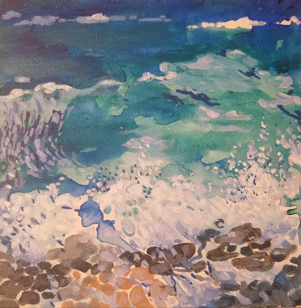 Breaking waves along a rocky coastline.